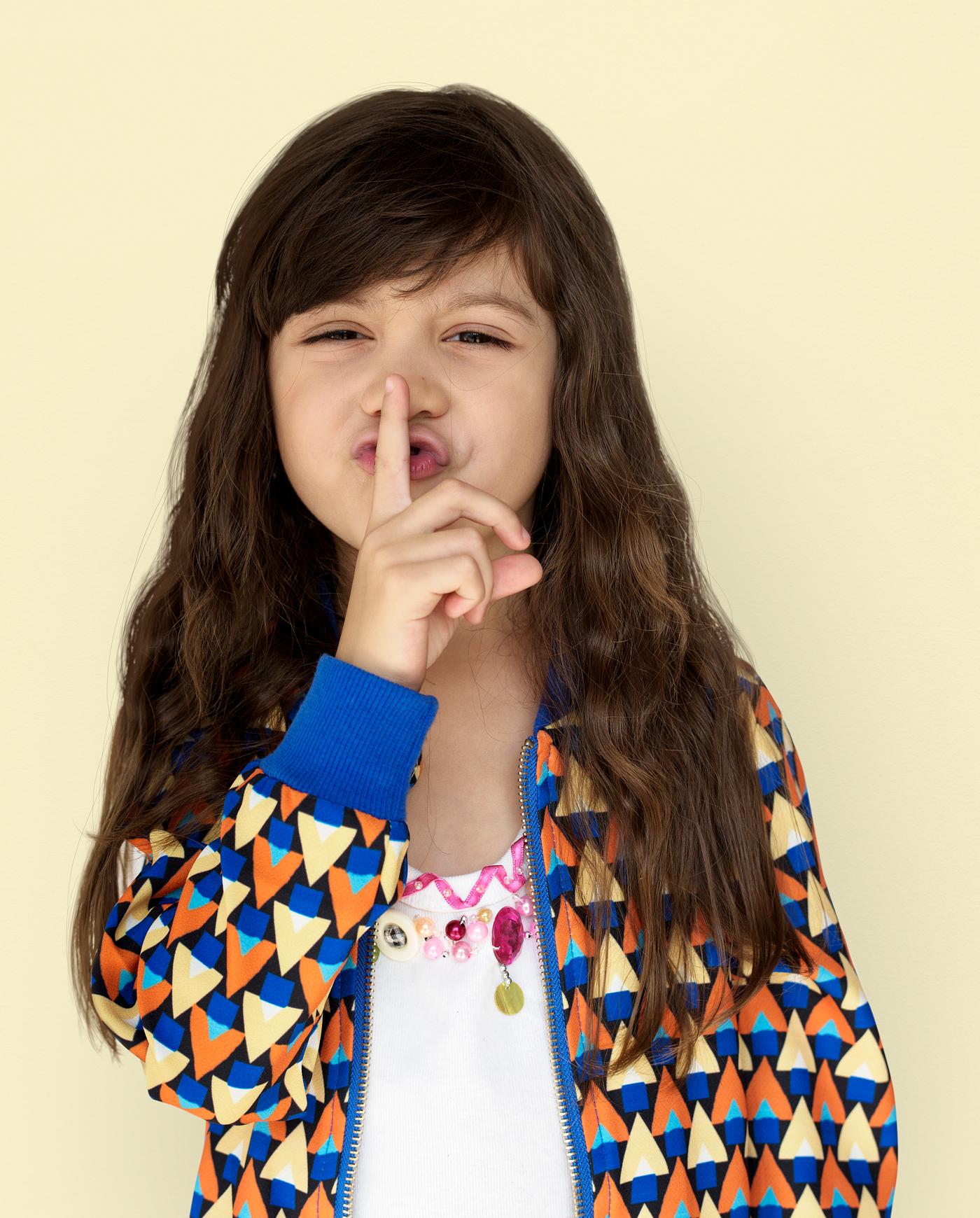 studio, expression, person, yellow, people, finger on lips, kid, solo, childhood, shh, smile, cheerful, smiling, isolated,... studio, expression, person, yellow, people, finger on lips, kid, solo, childhood, shh, smile, cheerful, smiling, isolated,...