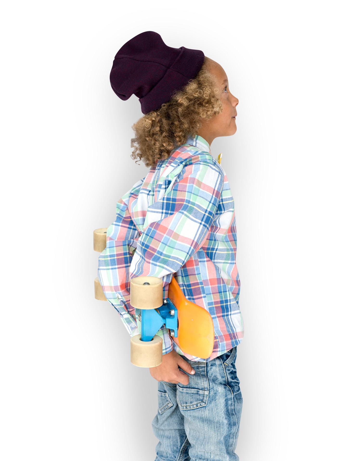 Boy holding a skateboard behind his back - expression, studio, person, isolated on white, beanie, little, people, kid, child... Boy holding a skateboard behind his back - expression, studio, person, isolated on white, beanie, little, people, kid, child...
