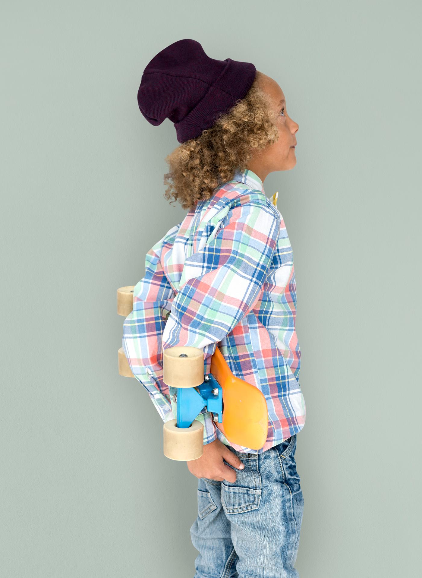 Boy holding a skateboard behind his back - expression, studio, person, beanie, little, people, kid, child, pose, childish,... Boy holding a skateboard behind his back - expression, studio, person, beanie, little, people, kid, child, pose, childish,...