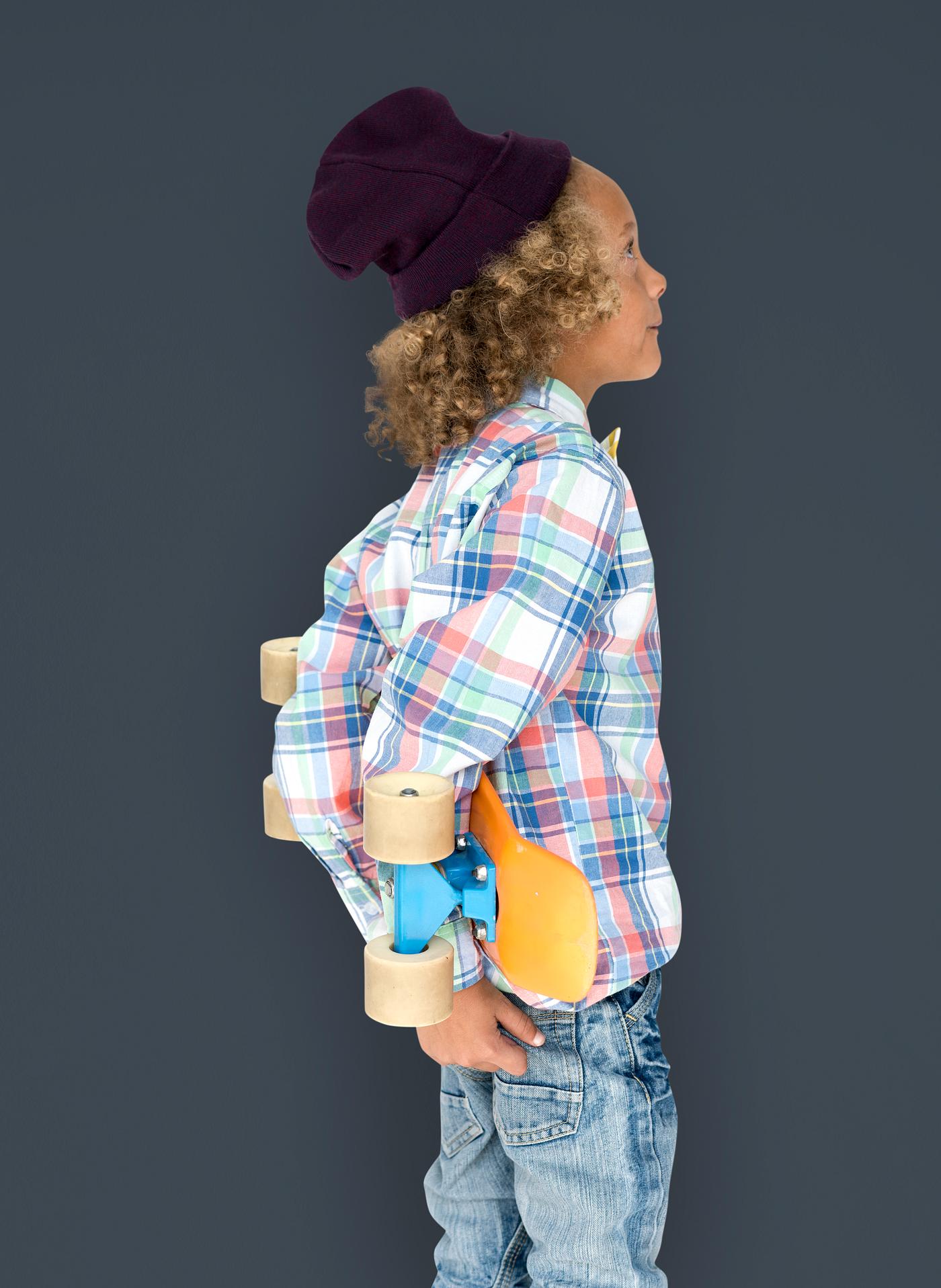 Boy holding a skateboard behind his back - expression, studio, person, beanie, little, people, kid, child, pose, childish,... Boy holding a skateboard behind his back - expression, studio, person, beanie, little, people, kid, child, pose, childish,...
