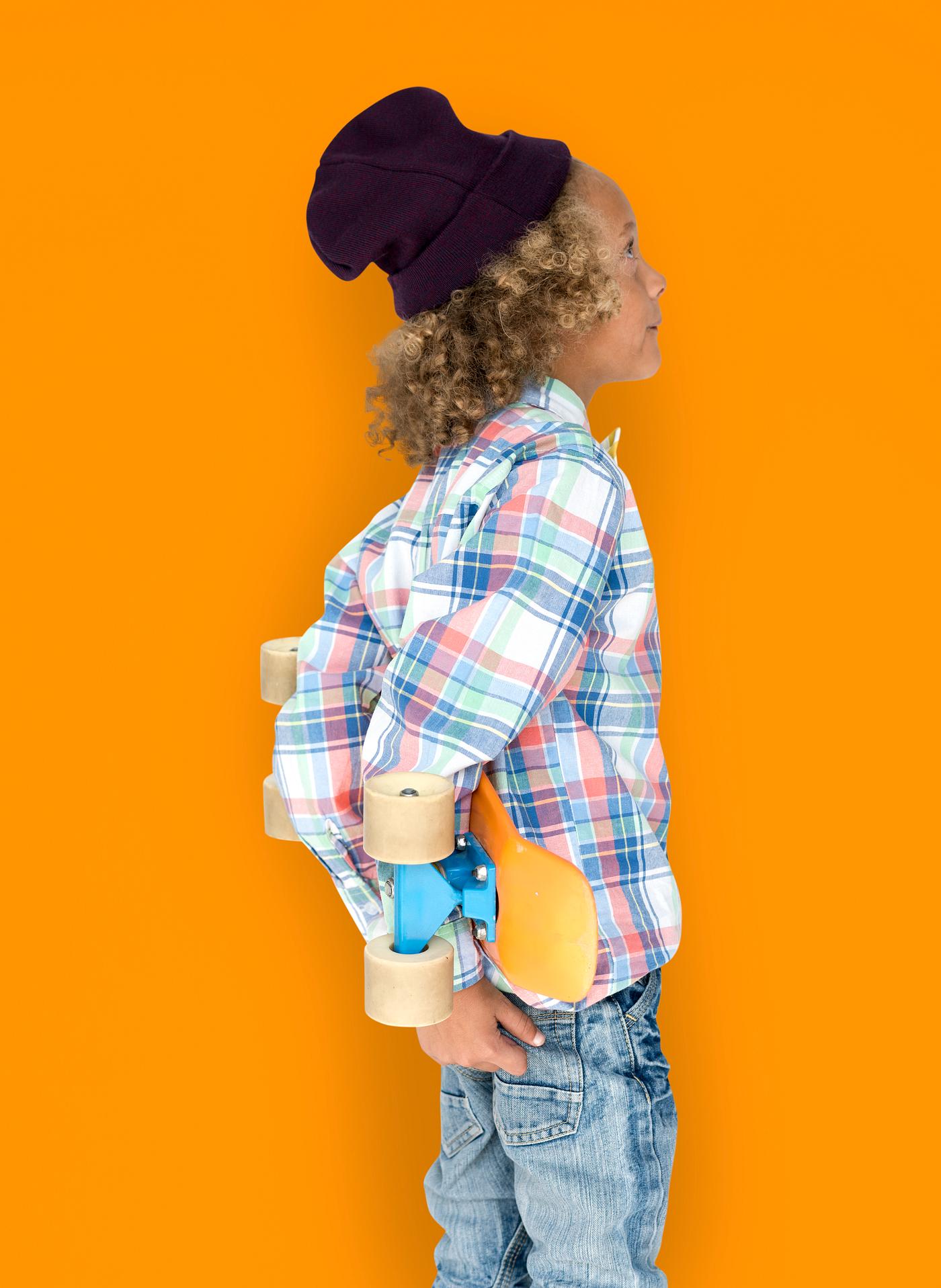 Boy holding a skateboard behind his back - expression, studio, person, beanie, little, people, kid, child, pose, childish,... Boy holding a skateboard behind his back - expression, studio, person, beanie, little, people, kid, child, pose, childish,...