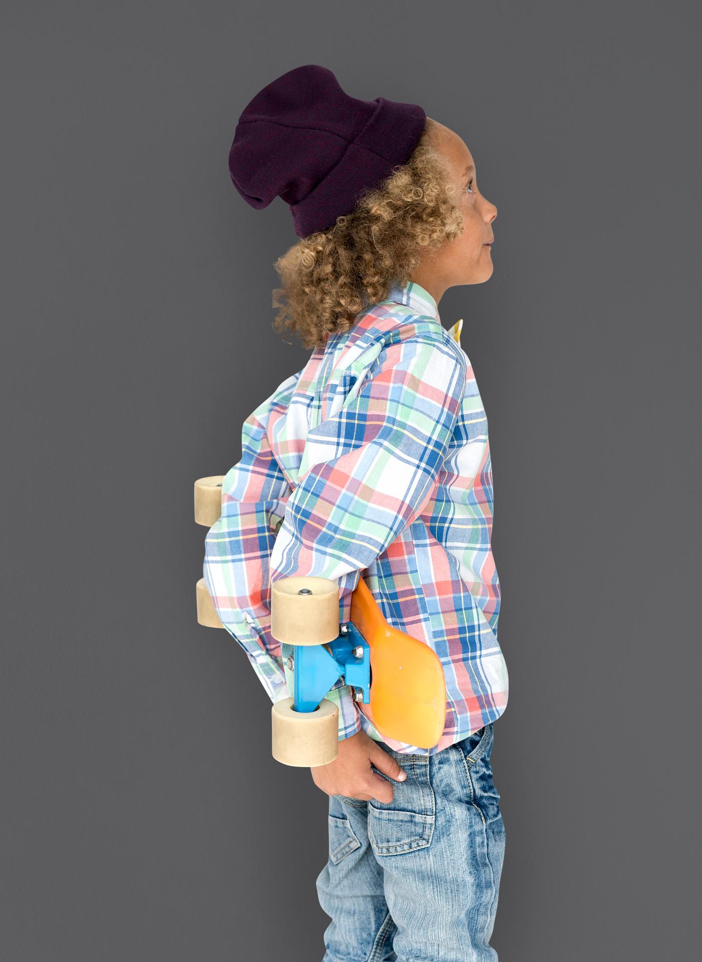Boy holding a skateboard behind his back - expression, studio, person, beanie, little, people, kid, child, pose, childish,... Boy holding a skateboard behind his back - expression, studio, person, beanie, little, people, kid, child, pose, childish,...
