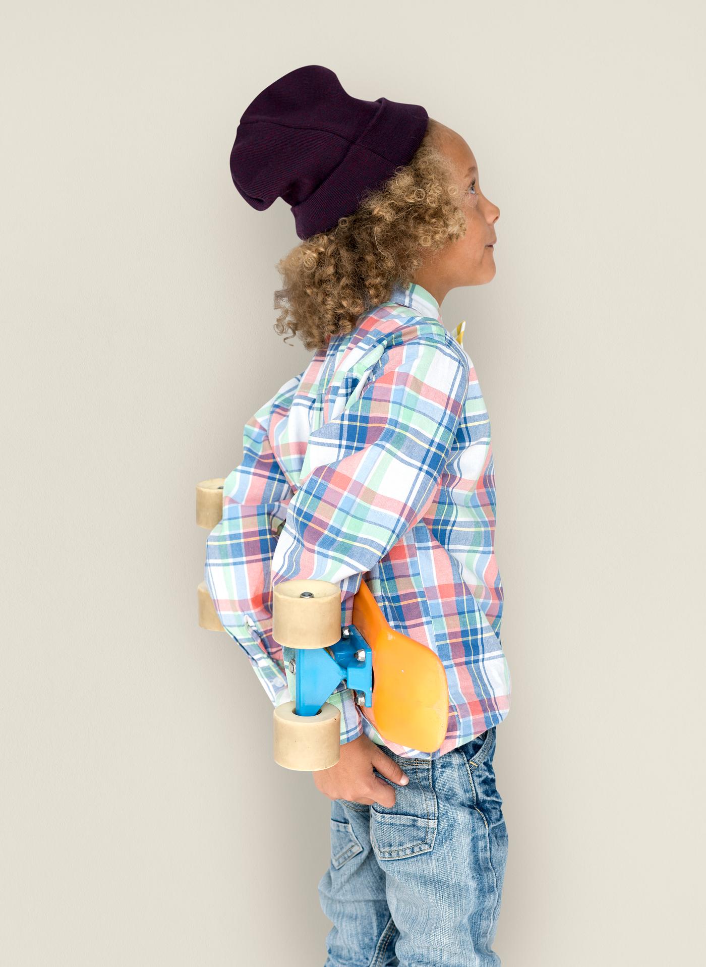 Boy holding a skateboard behind his back - expression, studio, person, beanie, little, people, kid, child, pose, childish,... Boy holding a skateboard behind his back - expression, studio, person, beanie, little, people, kid, child, pose, childish,...
