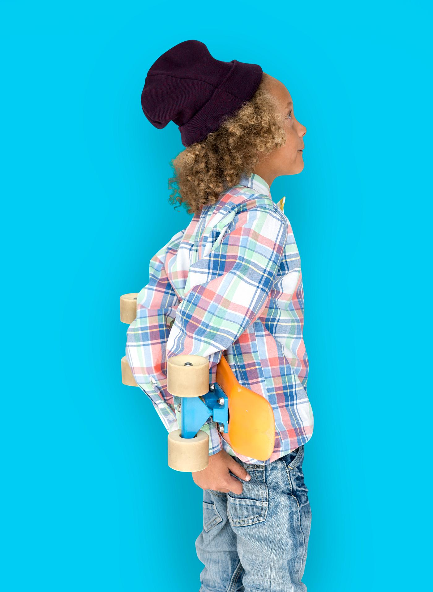 Boy holding a skateboard behind his back - expression, studio, person, beanie, little, people, kid, child, pose, childish,... Boy holding a skateboard behind his back - expression, studio, person, beanie, little, people, kid, child, pose, childish,...
