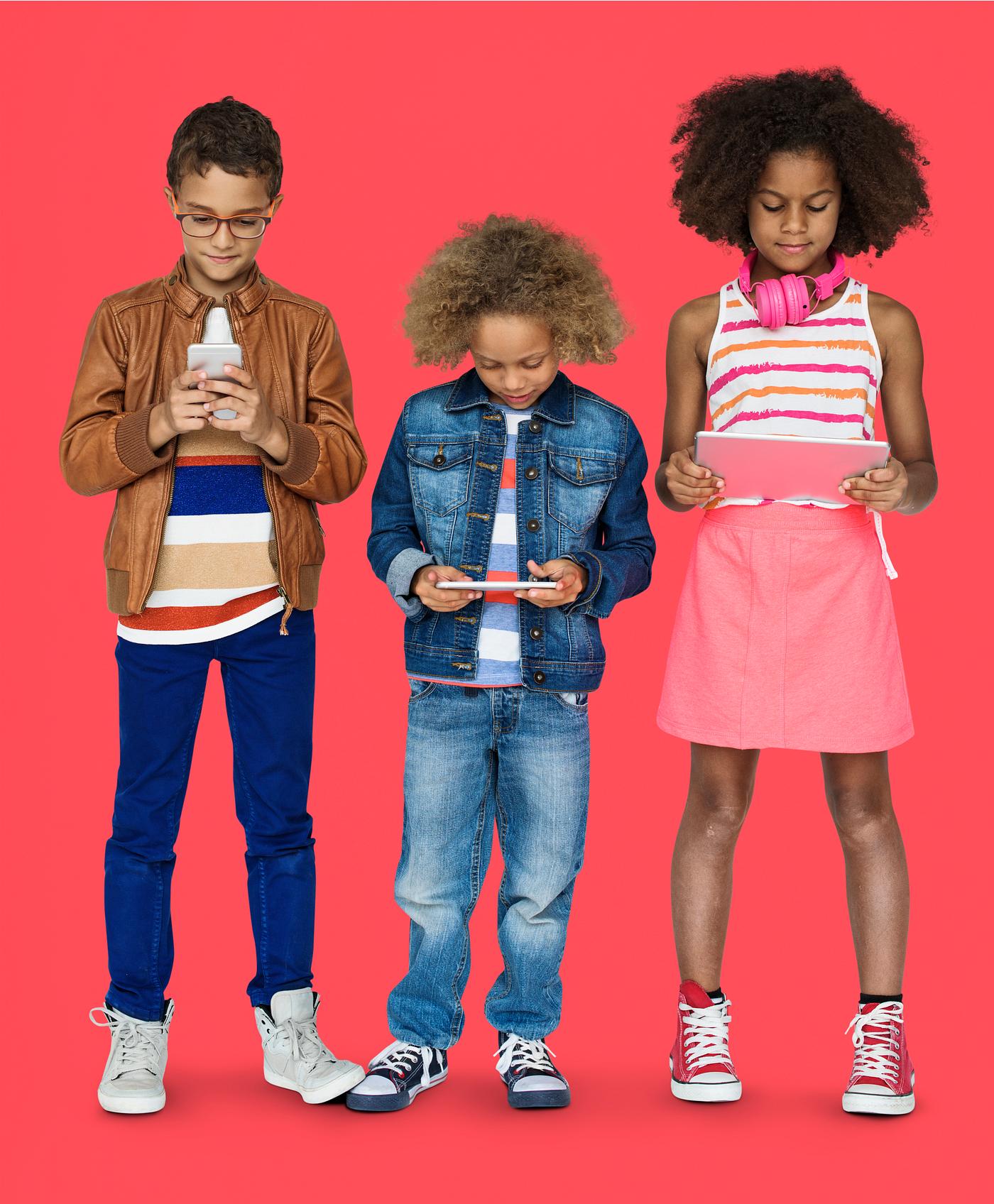 Kids using their digital devices - studio, expression, phone, person, technology, little, children, concentrating, focusing... Kids using their digital devices - studio, expression, phone, person, technology, little, children, concentrating, focusing...