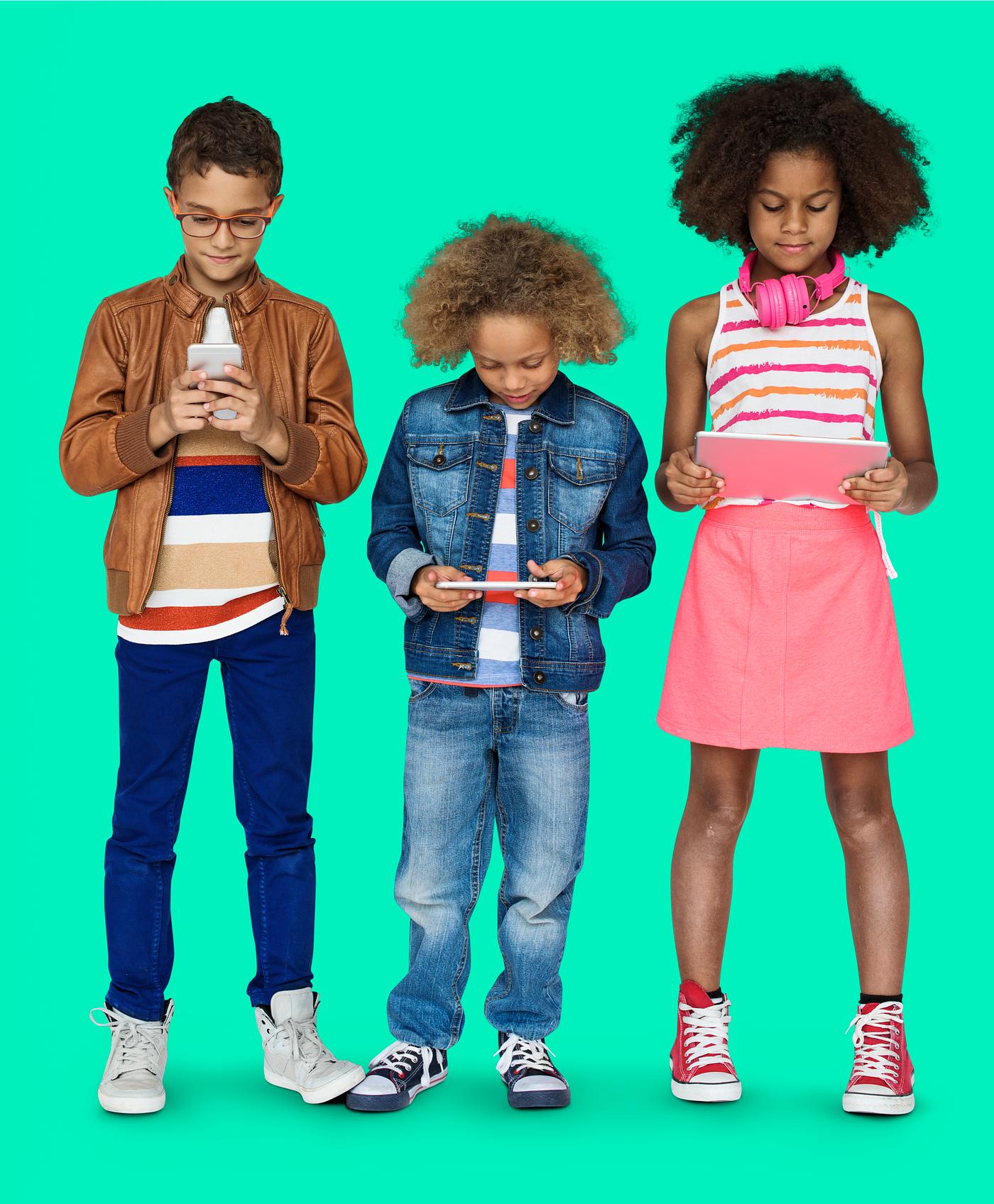 Kids using their digital devices - studio, expression, phone, person, technology, little, children, concentrating, focusing... Kids using their digital devices - studio, expression, phone, person, technology, little, children, concentrating, focusing...