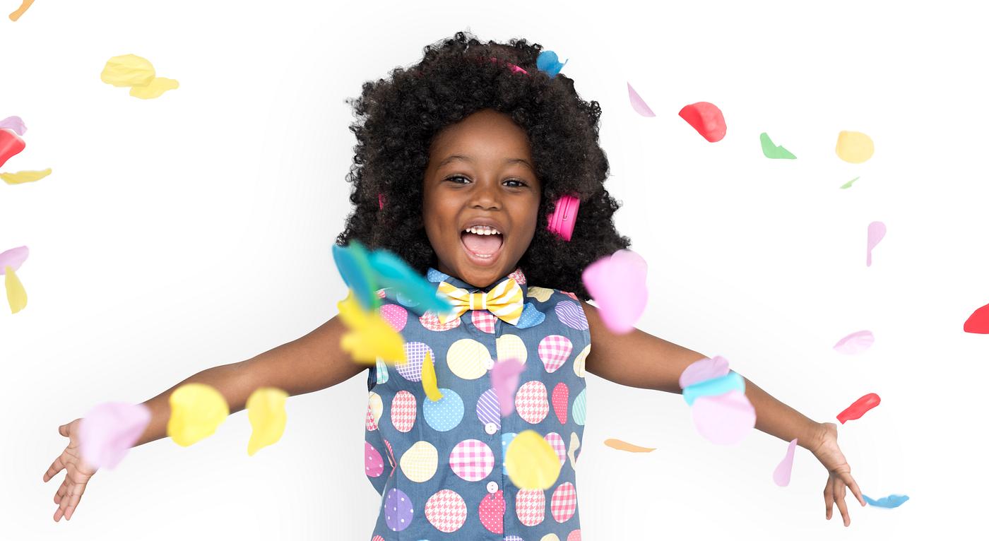 Girl with an afro enjoying colorful confetti - expression, studio, person, isolated on white, little, people, positivity,... Girl with an afro enjoying colorful confetti - expression, studio, person, isolated on white, little, people, positivity,...