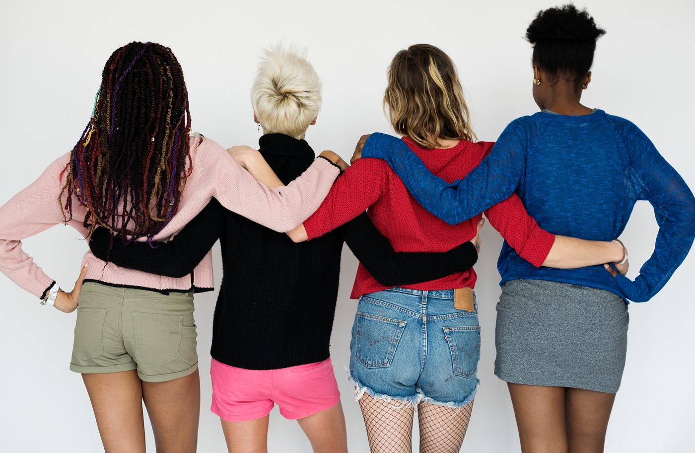 Diverse friends holding around each other Diverse friends holding around each other