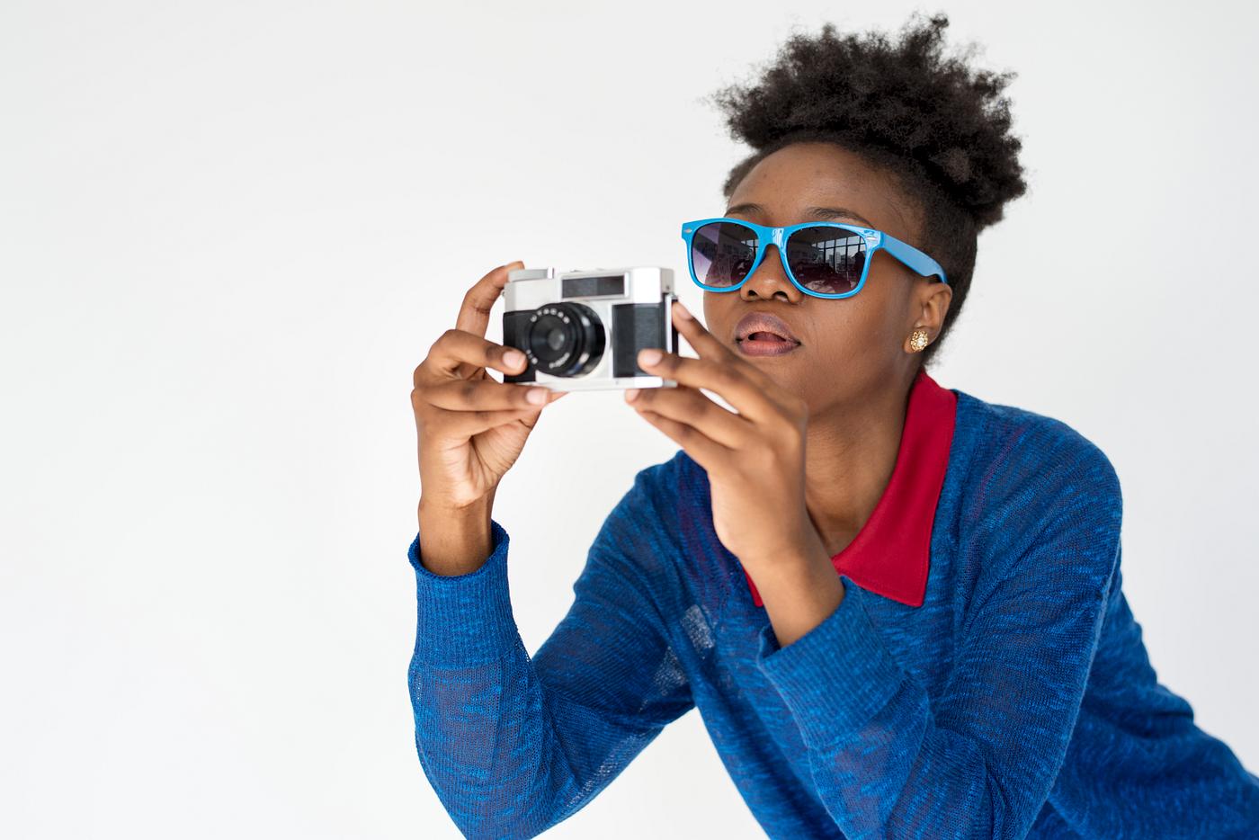 Portrait of a beautiful girl with a camera Portrait of a beautiful girl with a camera