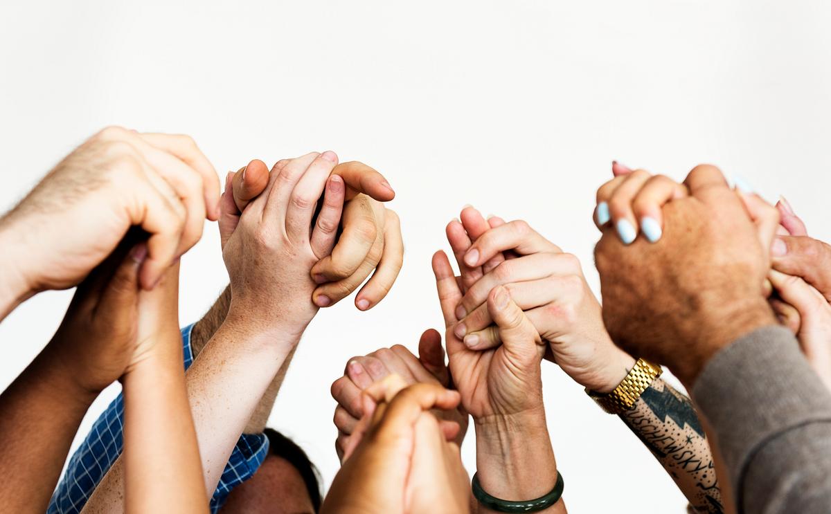 People raising and holding hands | Royalty free stock photo - 211933