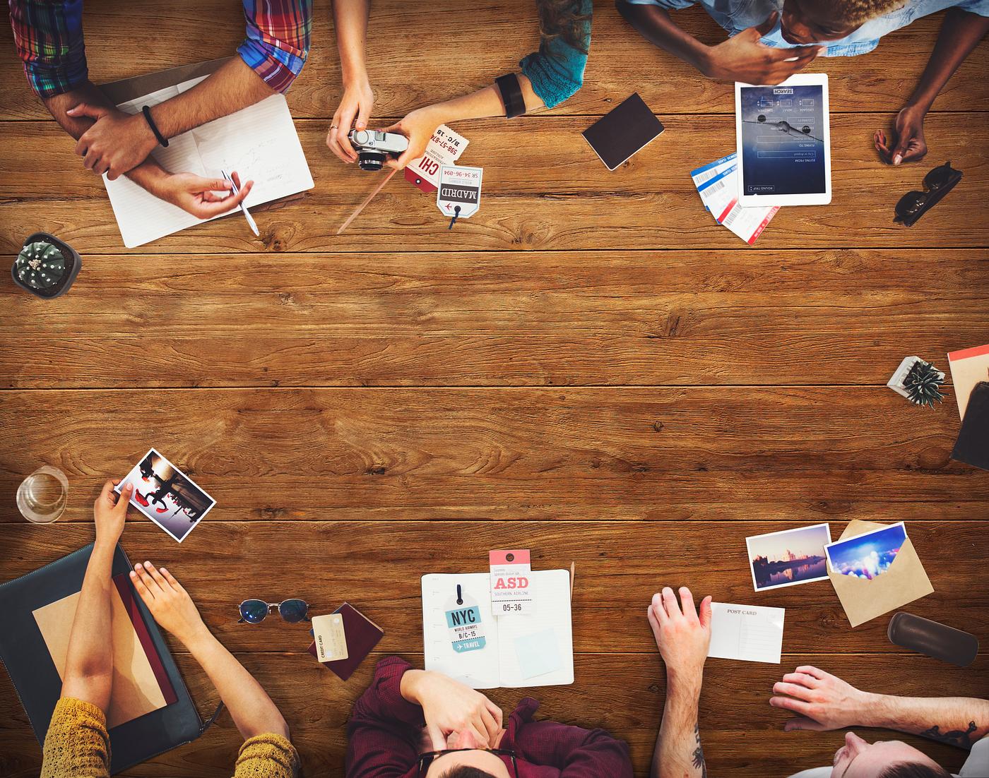 Group of diverse people are planning for a trip - tablet, brainstorm, thinking, booking, journey, aerial, african american,... Group of diverse people are planning for a trip - tablet, brainstorm, thinking, booking, journey, aerial, african american,...