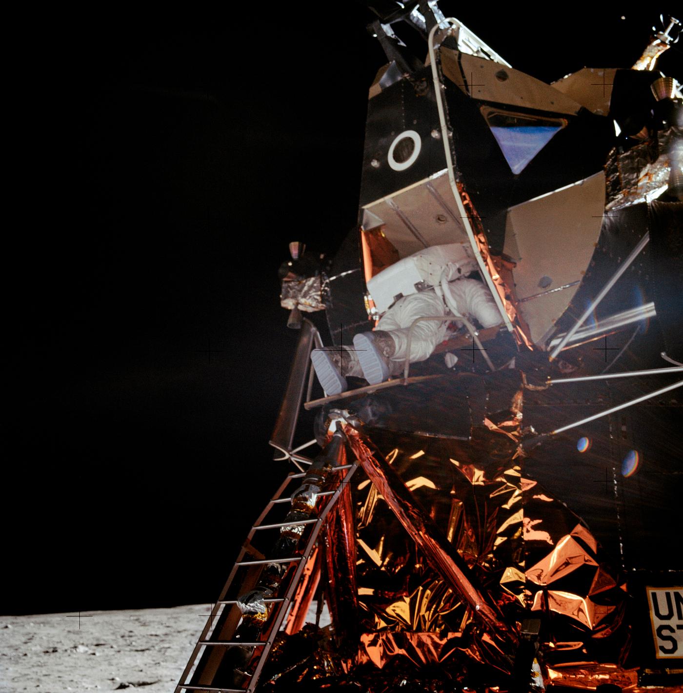 Astronaut Edwin E. Aldrin Jr., lunar module pilot, is photographed egressing the Lunar Module (LM) during the Apollo 11... Astronaut Edwin E. Aldrin Jr., lunar module pilot, is photographed egressing the Lunar Module (LM) during the Apollo 11...