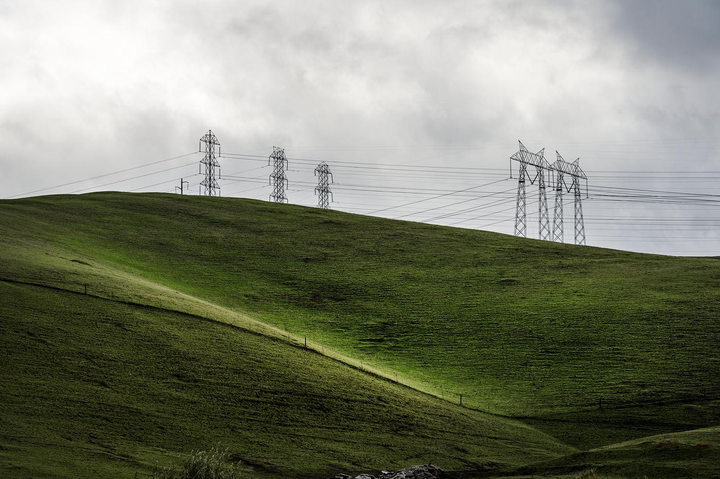 Lush green hills frame rows of power lines west of Modesto in California's San Joaquin Valley. Original image from Carol... Lush green hills frame rows of power lines west of Modesto in California's San Joaquin Valley. Original image from Carol...