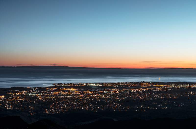 Santa Barbara in California Dusk shot of Santa Barbara, California, and the Pacific shore, taken from bluffs high above the city. Original image from…