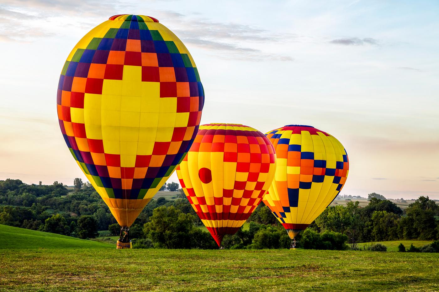 Colorful balloons land at the National Balloon Classic, a hot air balloon exhibition in Indianola, Iowa, a town near the... Colorful balloons land at the National Balloon Classic, a hot air balloon exhibition in Indianola, Iowa, a town near the...