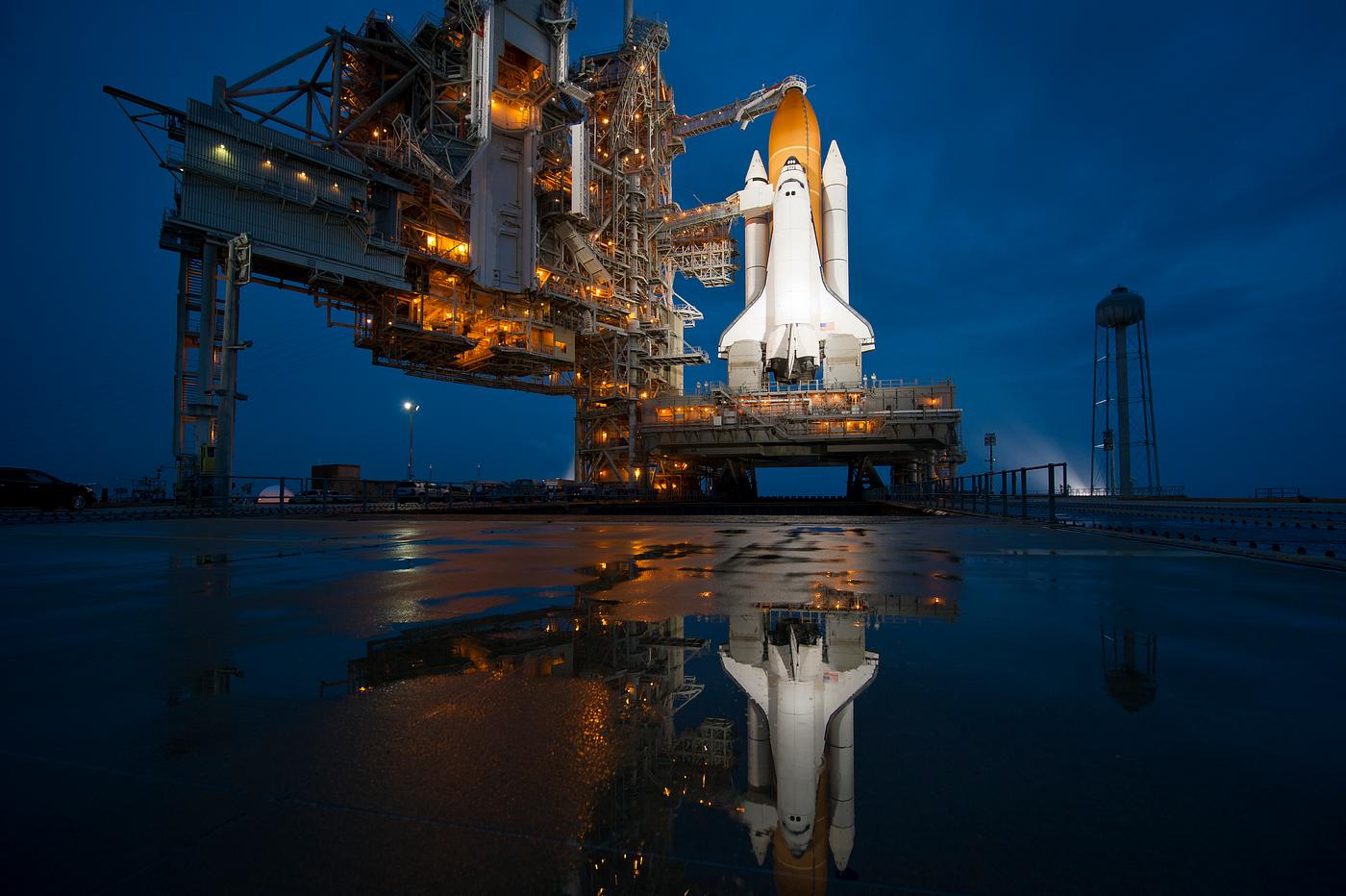 Atlantis is seen shortly after the rotating service structure was rolled back at launch pad 39a at the NASA Kennedy Space... Atlantis is seen shortly after the rotating service structure was rolled back at launch pad 39a at the NASA Kennedy Space...
