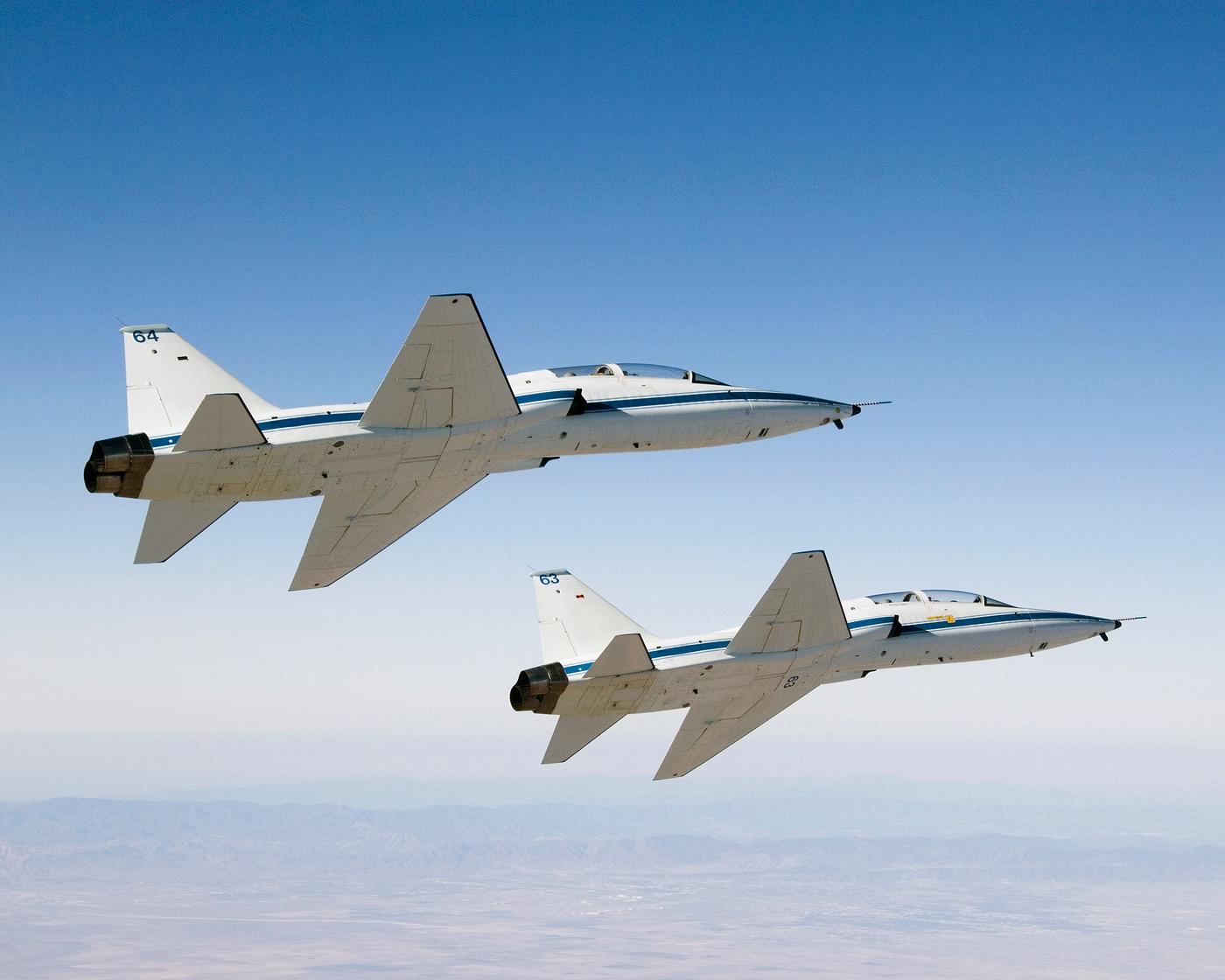 NASA Dryden's two T-38A mission support aircraft fly in tight formation, Sept 26th, 2007. Original from NASA. Digitally... NASA Dryden's two T-38A mission support aircraft fly in tight formation, Sept 26th, 2007. Original from NASA. Digitally...