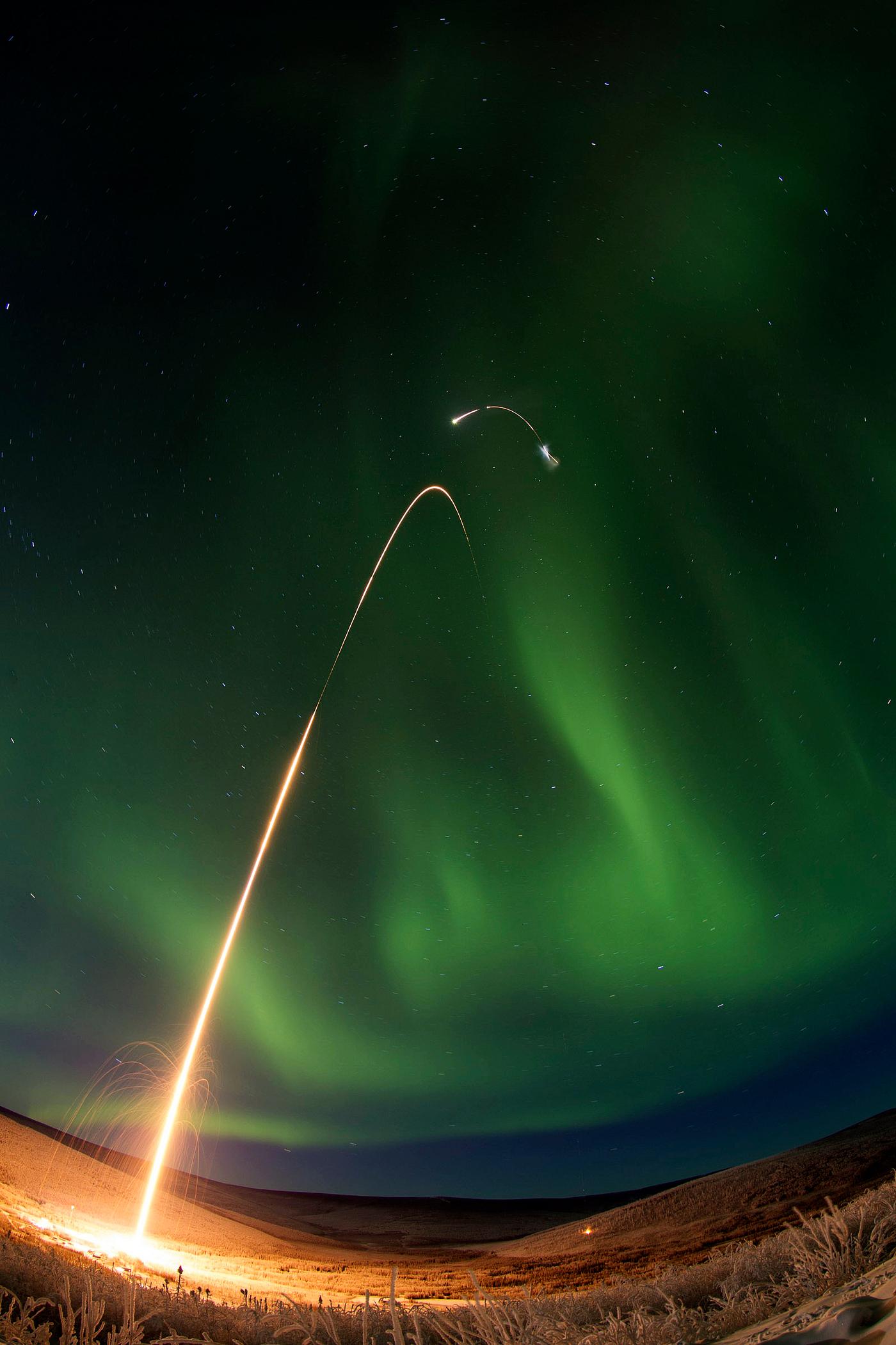 Sounding rocket launches successfully from Alaska and a green aurora dancing over Alaska. All four stages of the rocket are... Sounding rocket launches successfully from Alaska and a green aurora dancing over Alaska. All four stages of the rocket are...