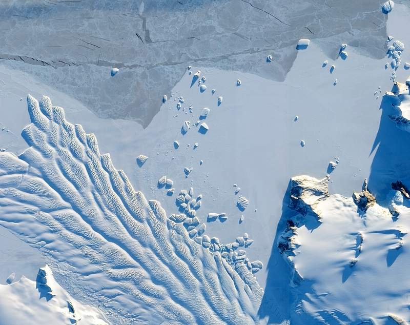 The Matusevich Glacier flows toward the coast of East Antarctica, pushing through a channel between the Lazarev Mountains and the northwestern tip of the Wilson Hills. Original from NASA. Digitally enhanced by rawpixel. The Matusevich Glacier flows toward the coast of East Antarctica, pushing through a channel between the Lazarev Mountains and…