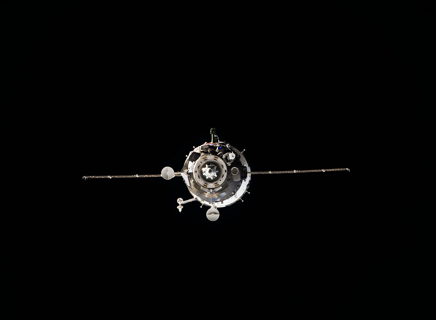 View from the International Space Station shows the Soyuz TMA-12M spacecraft shortly before docking of the two orbiting... View from the International Space Station shows the Soyuz TMA-12M spacecraft shortly before docking of the two orbiting...