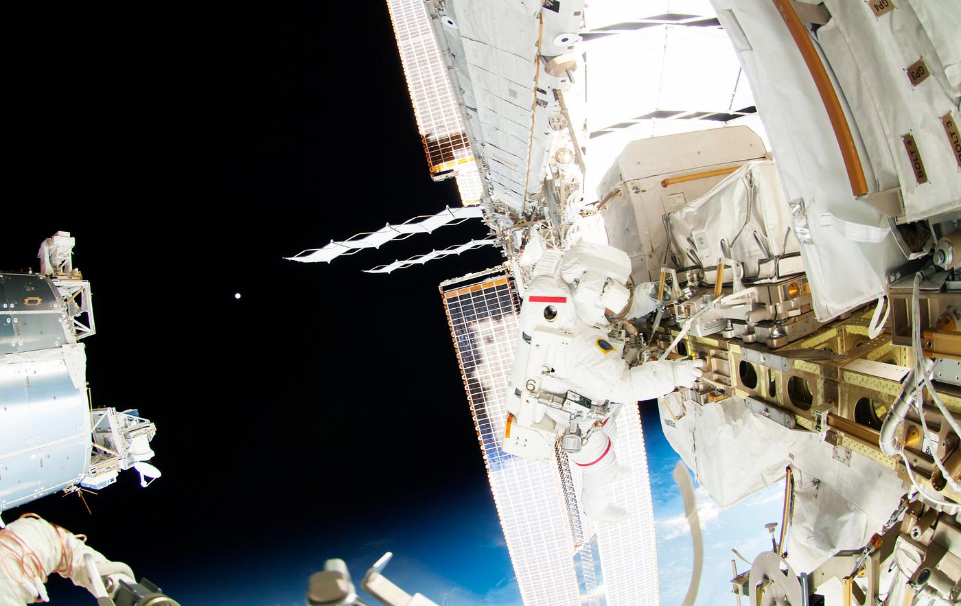 Astronauts working outside the space station's Quest airlock in Oct 7, 2014. Original from NASA . Digitally enhanced by... Astronauts working outside the space station's Quest airlock in Oct 7, 2014. Original from NASA . Digitally enhanced by...