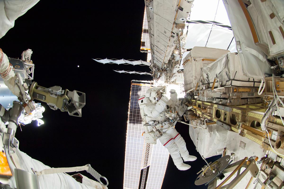 Astronauts working outside the space… | Free public domain photo Astronauts working outside the space station's Quest airlock in Oct 7, 2014. Original from NASA. Digitally enhanced by…