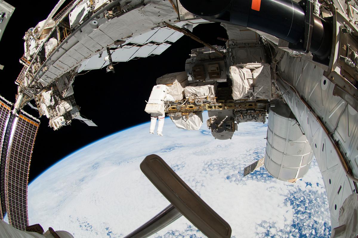Astronauts working outside the space… | Free public domain photo Astronauts working outside the space station's Quest airlock in Oct 7, 2014. Original from NASA. Digitally enhanced by…