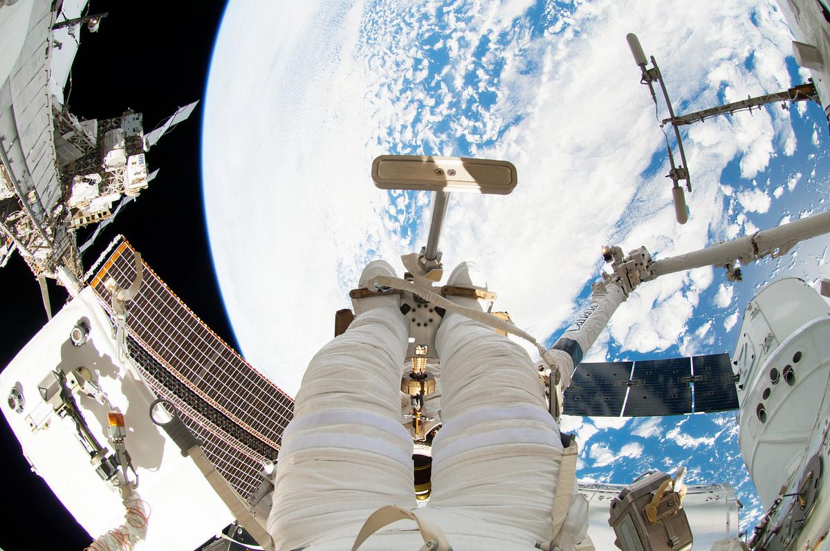 Astronauts working outside the space… | Free public domain photo Astronauts working outside the space station's Quest airlock in Oct 7, 2014. Original from NASA. Digitally enhanced by…