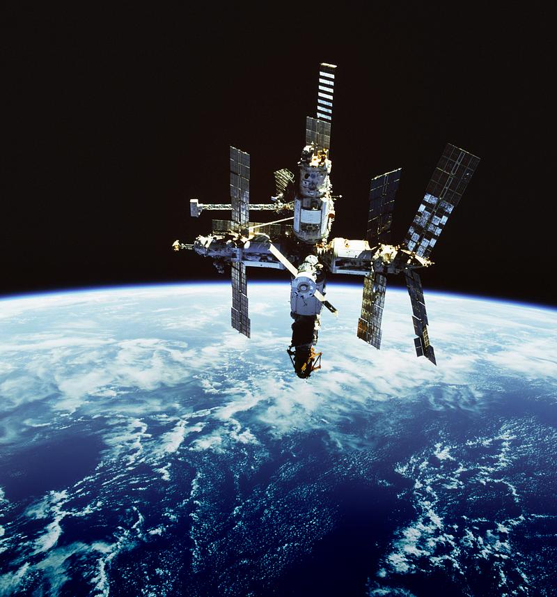 Russian space station Russia's Mir space station is backdropped against Earth's horizon. Original from NASA . Digitally enhanced by rawpixel.