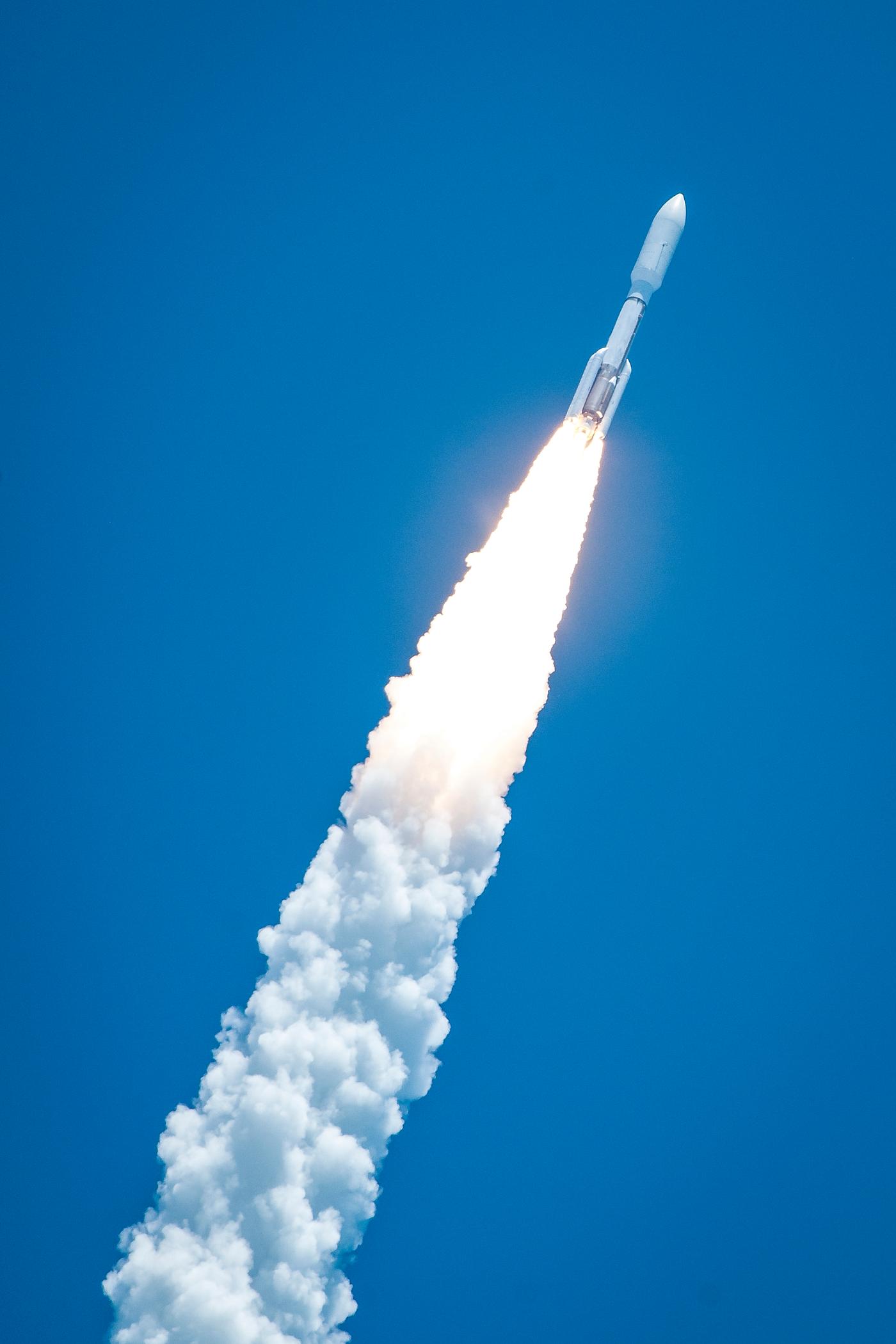 Rising from fire and smoke, NASA's Juno planetary probe, enclosed in its payload fairing, launches atop a United Launch... Rising from fire and smoke, NASA's Juno planetary probe, enclosed in its payload fairing, launches atop a United Launch...