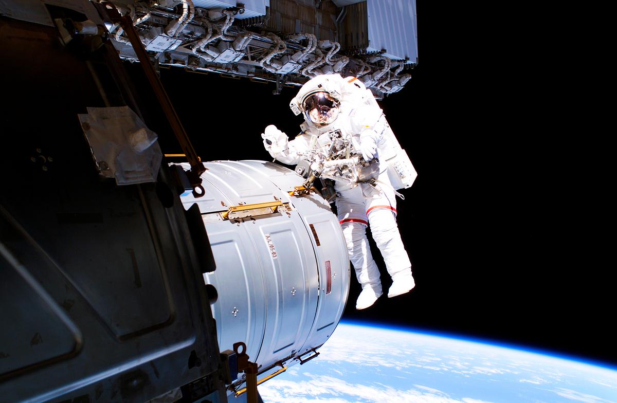 Astronaut in space | Free public domain photo Astronaut Jeffrey N. Williams during EVA 5 on Expedition 13. Original from NASA. Digitally enhanced by rawpixel.