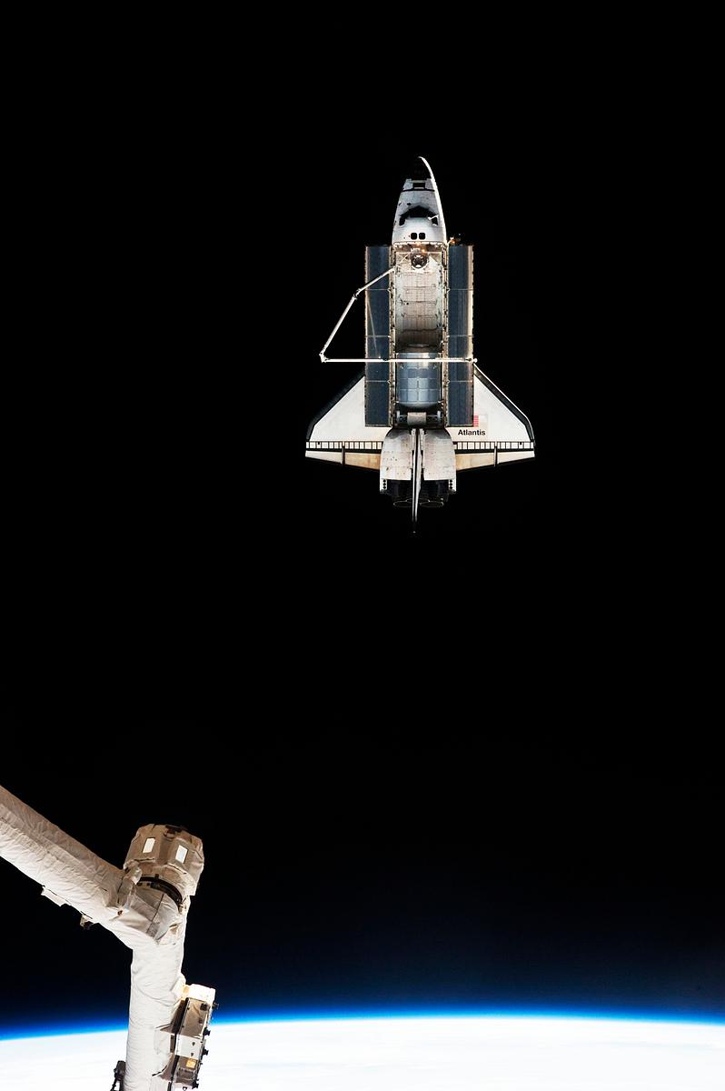 STS-135 Shuttle Atlantis leaving the ISS, 19… | Free public domain photo STS-135 Shuttle Atlantis leaving the ISS, 19 July 2011. Original from NASA. Digitally enhanced by rawpixel.