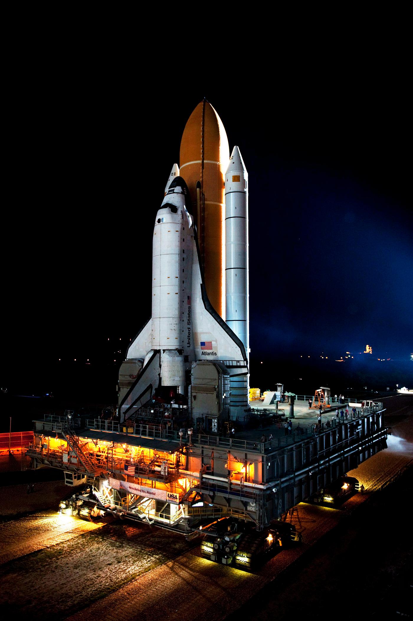 Space shuttle Atlantis, attached to its bright-orange external fuel tank and twin solid rocket boosters on Launch Pad 39A at... Space shuttle Atlantis, attached to its bright-orange external fuel tank and twin solid rocket boosters on Launch Pad 39A at...
