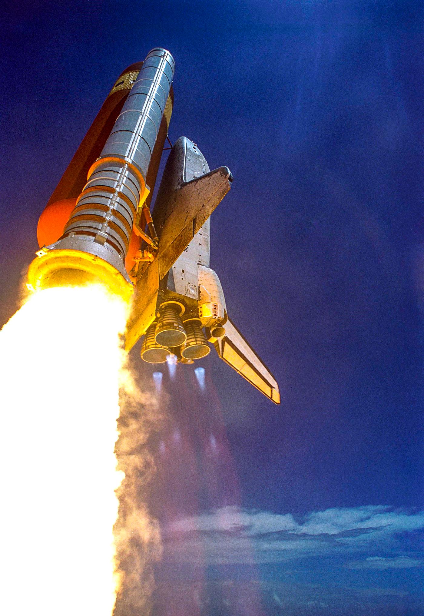 Making history with the first-ever launch on Independence Day, Space Shuttle Discovery rockets into the blue sky on mission... Making history with the first-ever launch on Independence Day, Space Shuttle Discovery rockets into the blue sky on mission...