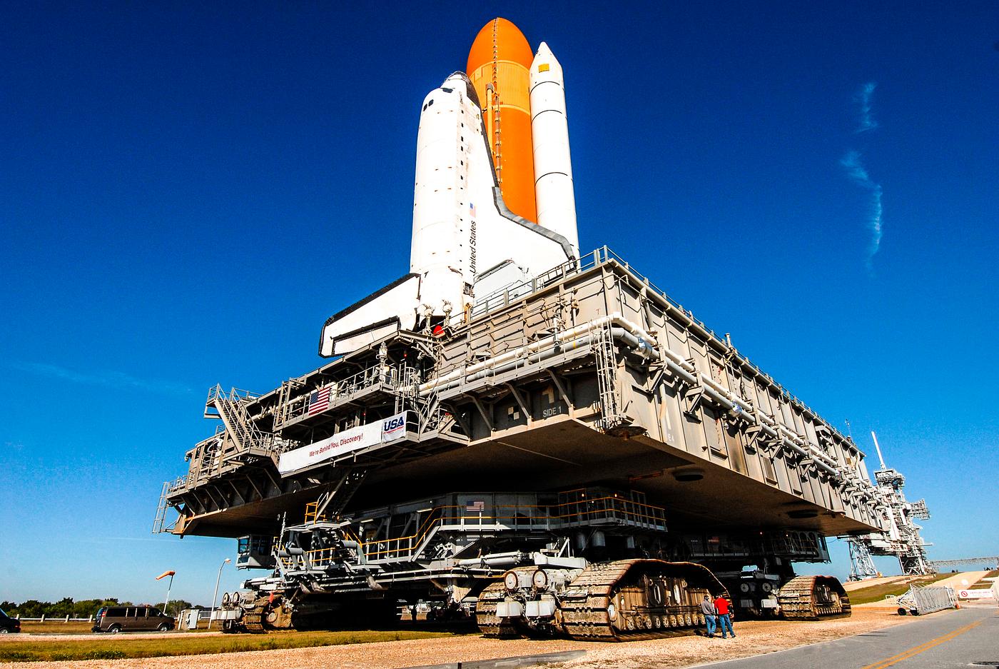Space shuttle Discovery, atop the mobile launcher platform and crawler-transporter, approaches the ramp to Launch Pad 39A at... Space shuttle Discovery, atop the mobile launcher platform and crawler-transporter, approaches the ramp to Launch Pad 39A at...