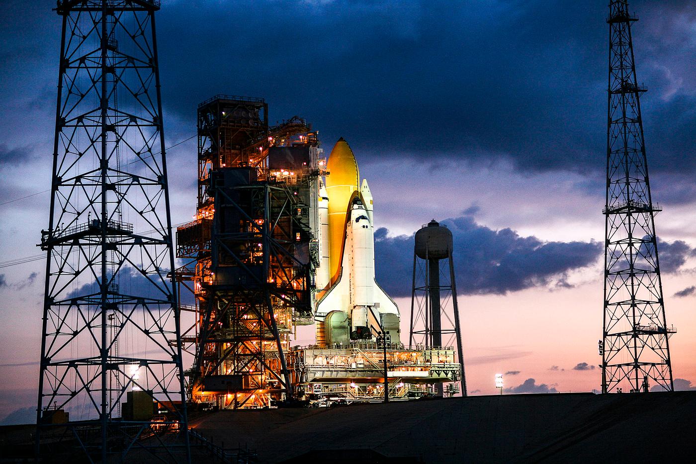 Just before dawn, space shuttle Endeavour is bathed in xenon lights after being secured on Launch Pad 39B. Original from... Just before dawn, space shuttle Endeavour is bathed in xenon lights after being secured on Launch Pad 39B. Original from...