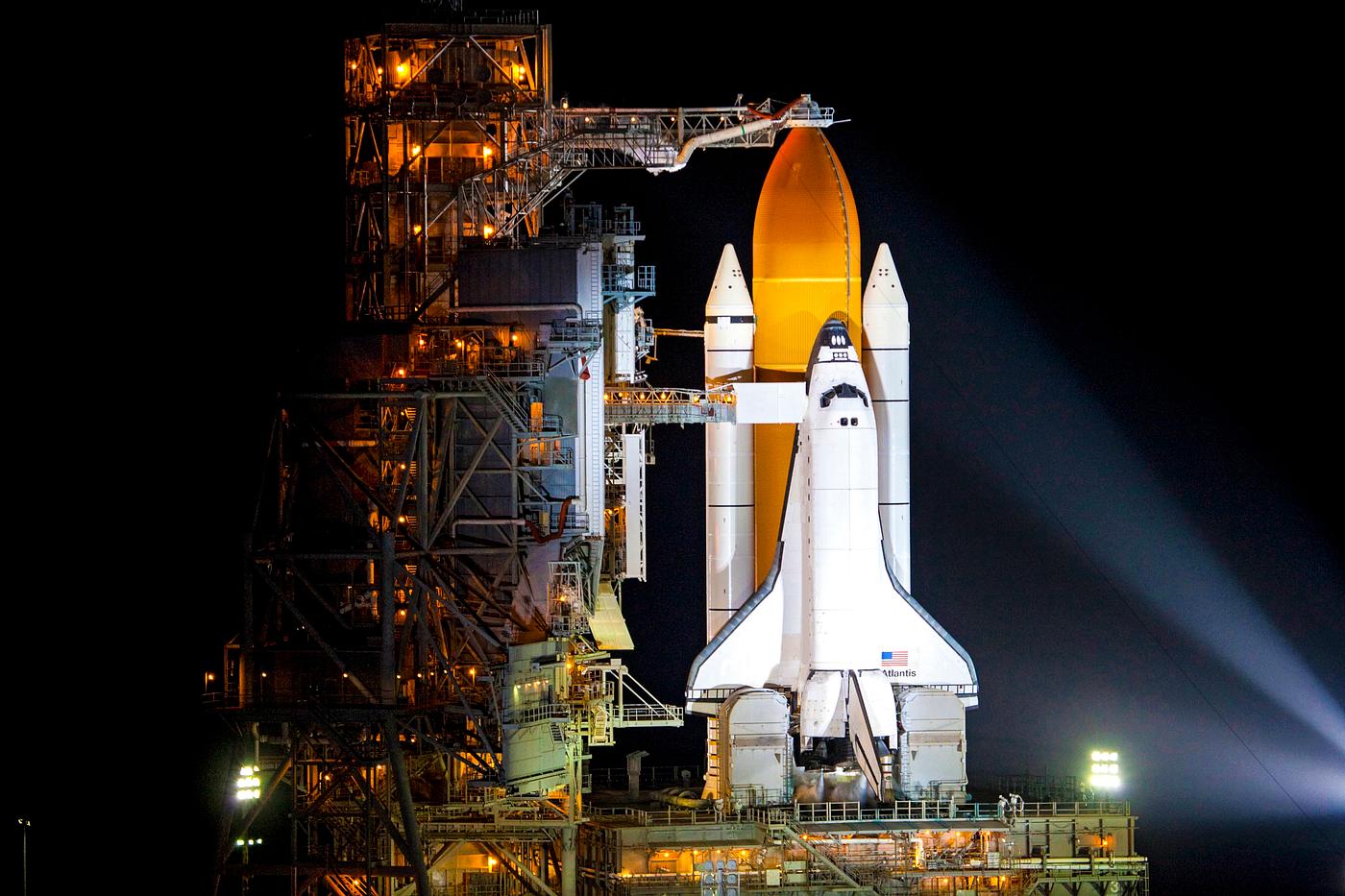 Space shuttle Atlantis, attached to its bright-orange external fuel tank and twin solid rocket boosters on Launch Pad 39A at... Space shuttle Atlantis, attached to its bright-orange external fuel tank and twin solid rocket boosters on Launch Pad 39A at...