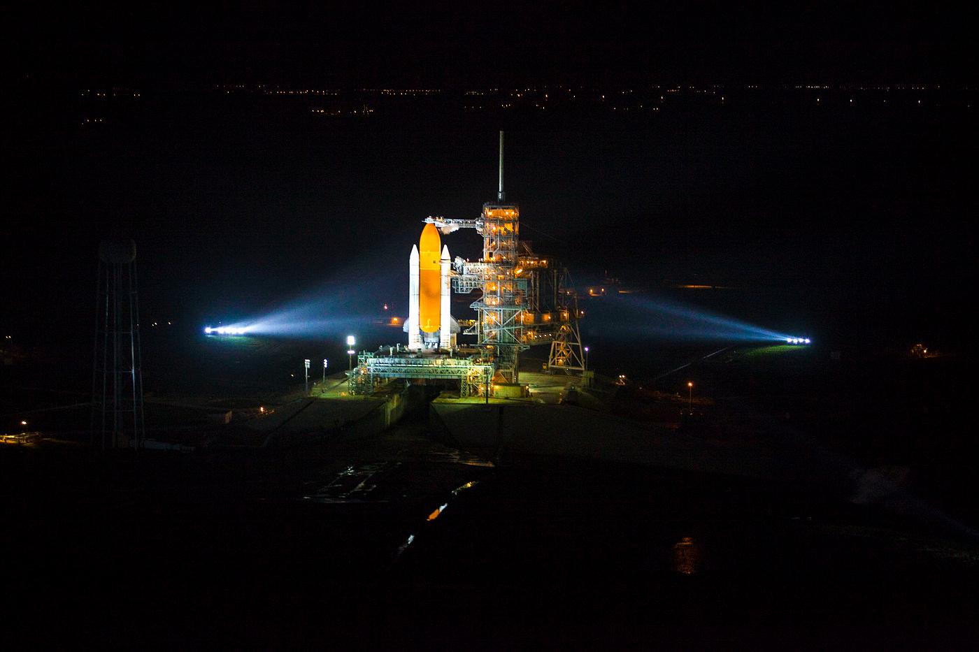 Space shuttle Atlantis, attached to its bright-orange external fuel tank and twin solid rocket boosters on Launch Pad 39A at... Space shuttle Atlantis, attached to its bright-orange external fuel tank and twin solid rocket boosters on Launch Pad 39A at...