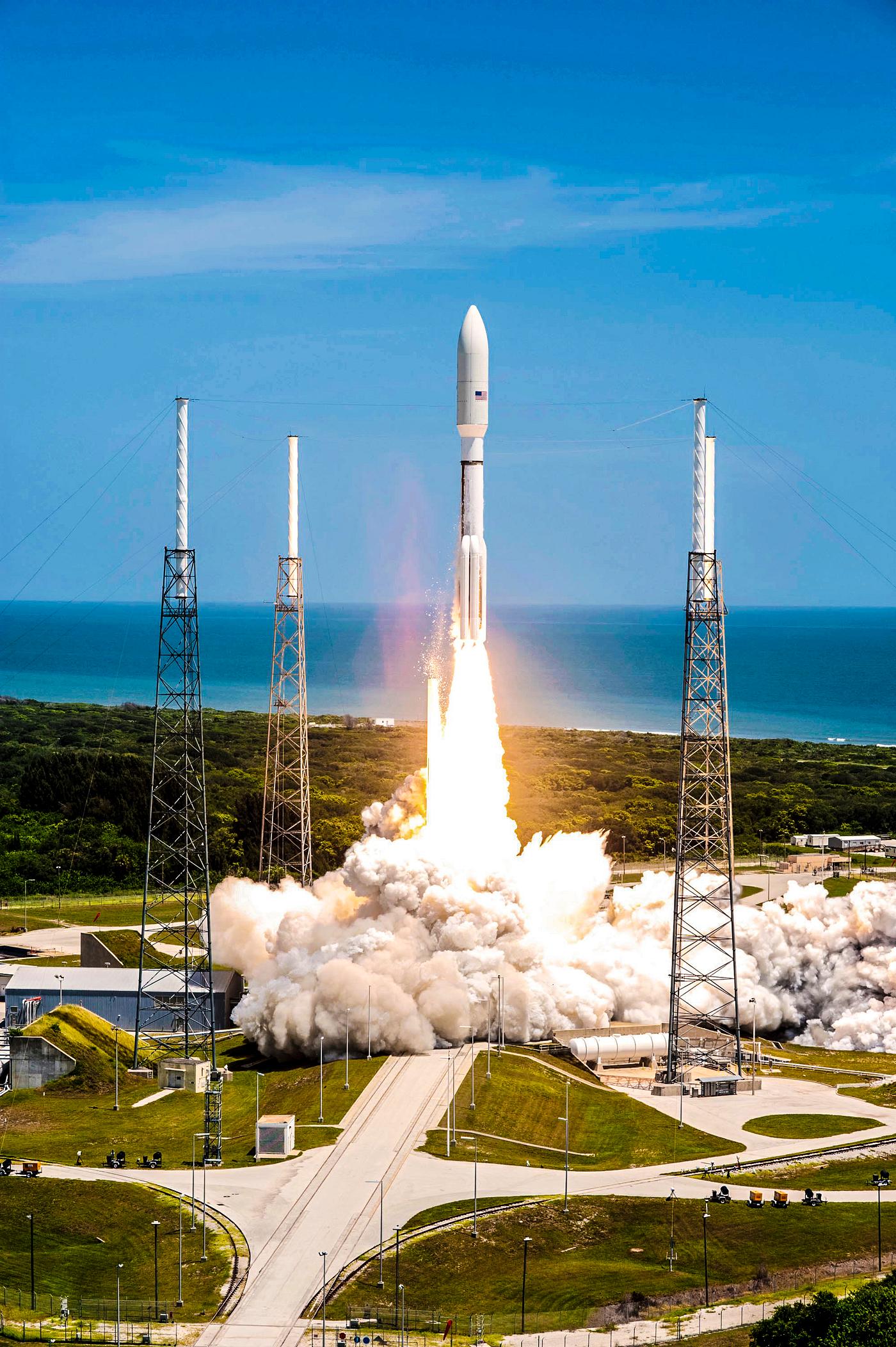 Rising from fire and smoke, NASA's Juno planetary probe, enclosed in its payload fairing, launches atop a United Launch... Rising from fire and smoke, NASA's Juno planetary probe, enclosed in its payload fairing, launches atop a United Launch...