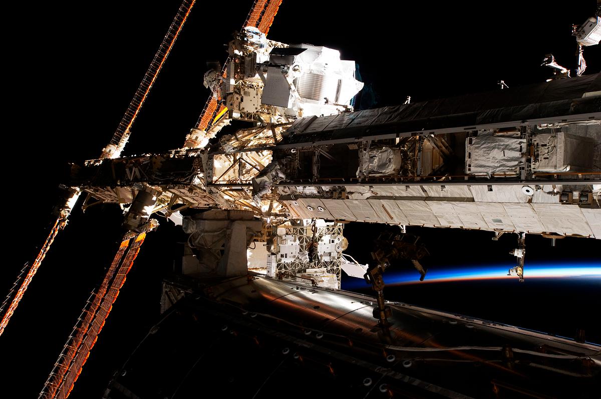 View of the crew members outside of the… | Free public domain photo View of the crew members outside of the International Space Station. Original from NASA. Digitally enhanced by rawpixel.