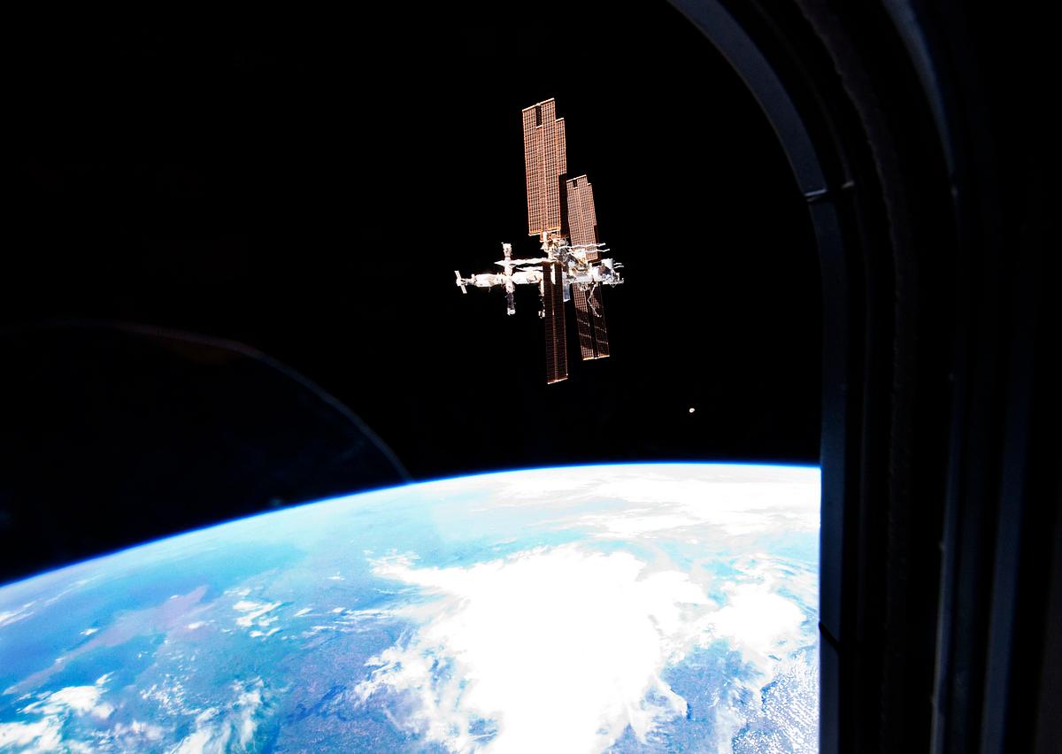 The International Space Station was… | Free public domain photo The International Space Station was photographed from the space shuttle Atlantis as the orbiting complex and the shuttle…