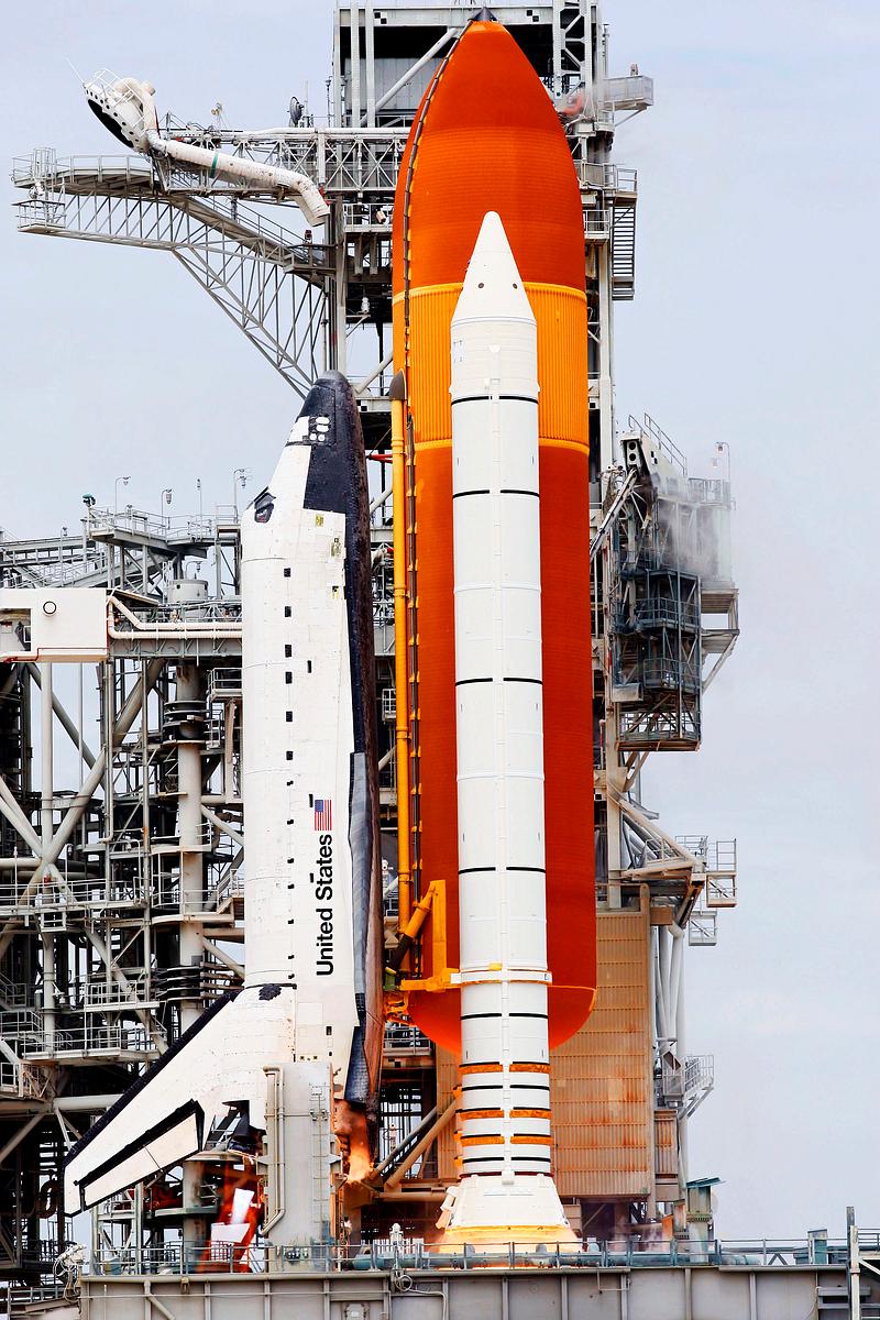 Space shuttle Atlantis, attached to its… | Free public domain photo Space shuttle Atlantis, attached to its bright-orange external fuel tank and twin solid rocket boosters on Launch Pad 39A at…
