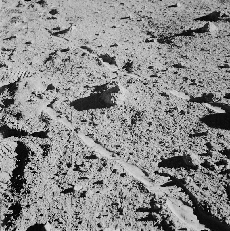 Two moon-exploring crew men of the Apollo 14 lunar landing mission, photographed and collected the large rock pictured just above the exact center of this picture. Original from NASA. Digitally enhanced by rawpixel. Two moon-exploring crew men of the Apollo 14 lunar landing mission, photographed and collected the large rock pictured just…