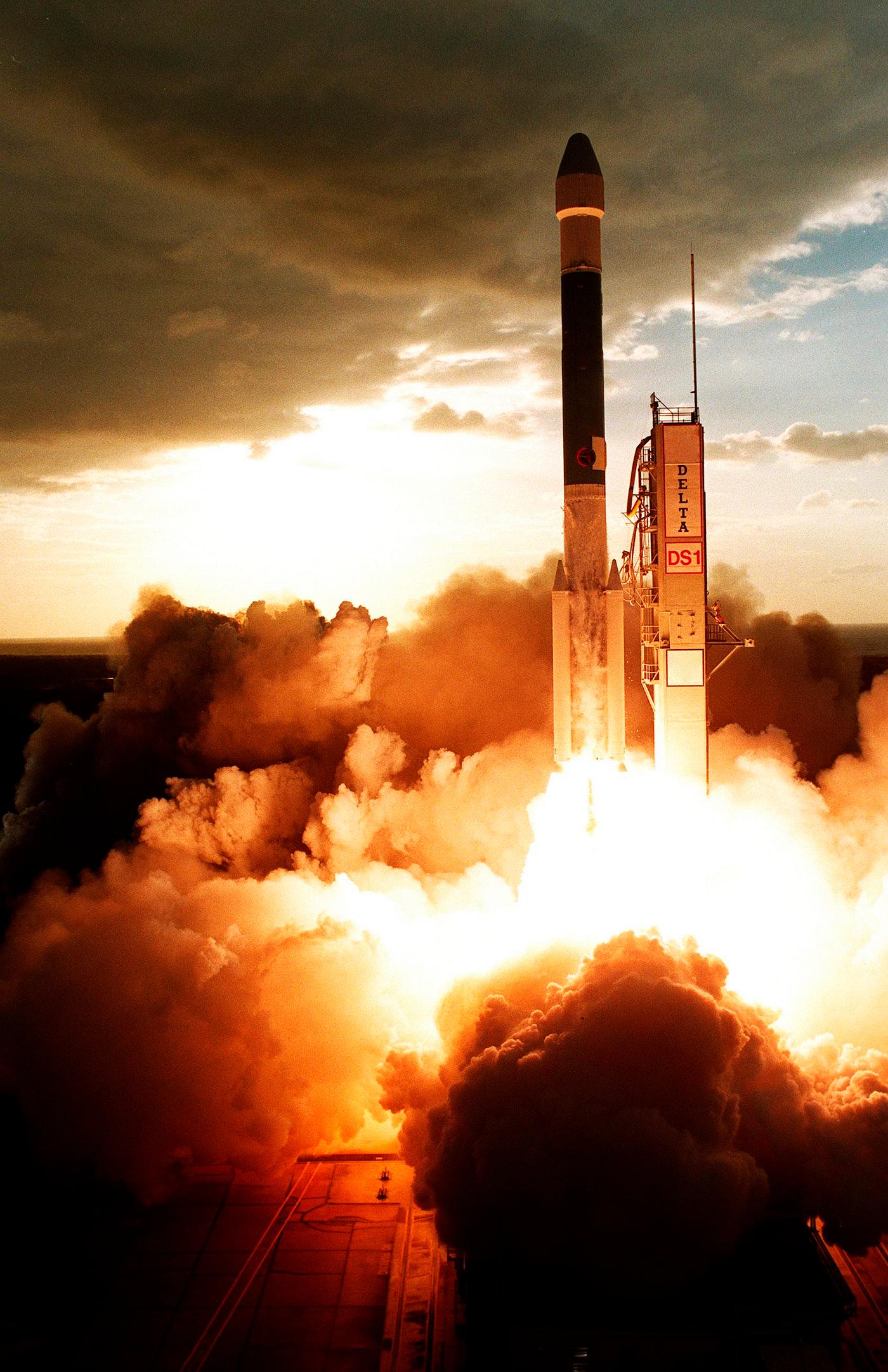 A Boeing Delta II (7326) rocket lights up the clouds of exhaust below as it propels Deep Space 1 into the sky after liftoff... A Boeing Delta II (7326) rocket lights up the clouds of exhaust below as it propels Deep Space 1 into the sky after liftoff...