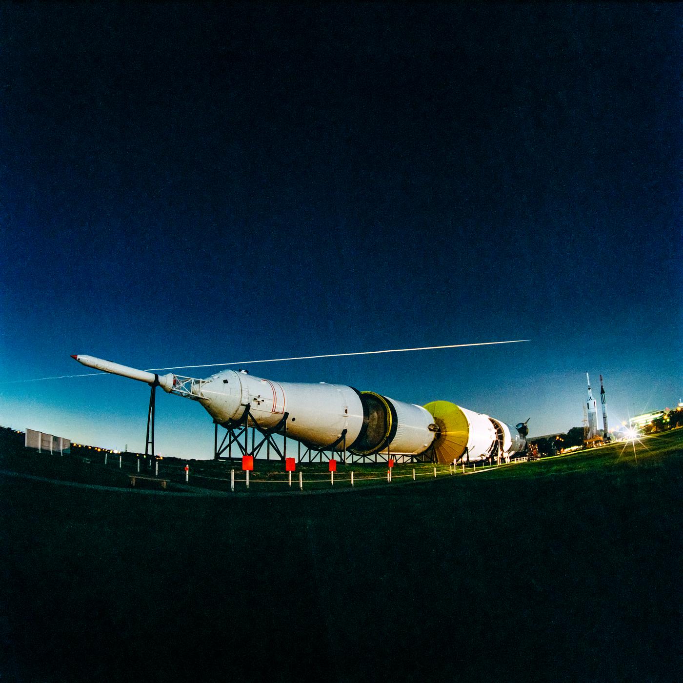 The fly-over of Space Shuttle Columbia's STS-93 re-entry is seen above the Johnson Space Center's Rocket Park.... The fly-over of Space Shuttle Columbia's STS-93 re-entry is seen above the Johnson Space Center's Rocket Park....