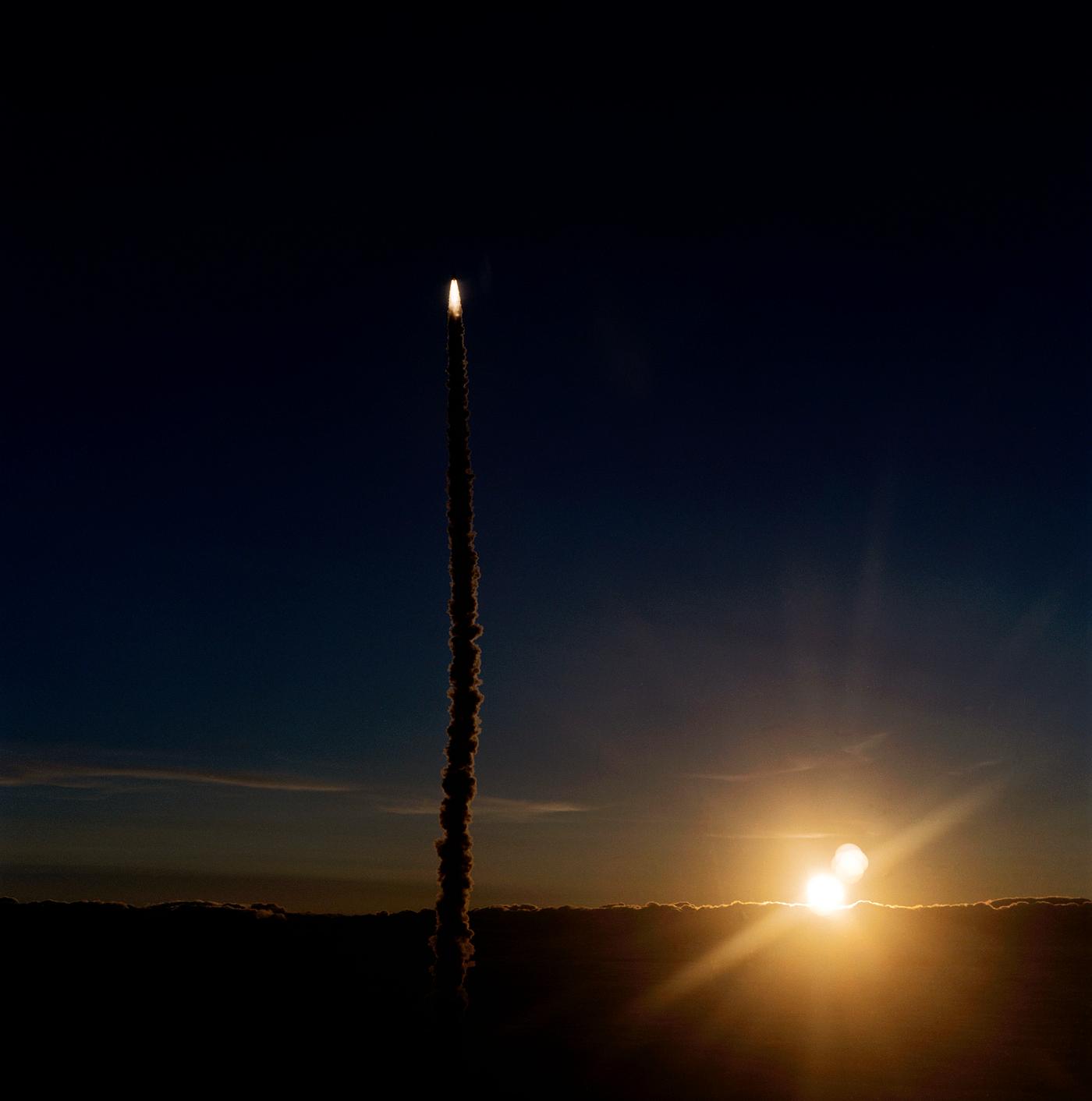 The Space Shuttle Endeavour is captured atop a trail of smoke as it carries six astronauts toward the fourth NASA Space... The Space Shuttle Endeavour is captured atop a trail of smoke as it carries six astronauts toward the fourth NASA Space...