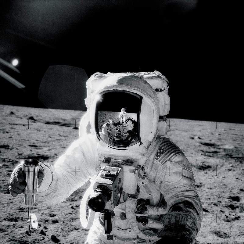 Astronaut Alan Bean holds Special Environmental Sample Container. Original from NASA. Digitally enhanced by rawpixel.