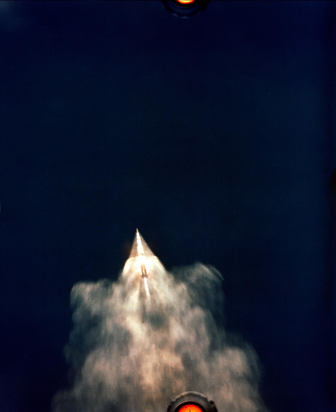 Early moments of the Apollo 11 launch. The 7.6 million-pound thrust Saturn V first stage boosts the space vehicle to an... Early moments of the Apollo 11 launch. The 7.6 million-pound thrust Saturn V first stage boosts the space vehicle to an...
