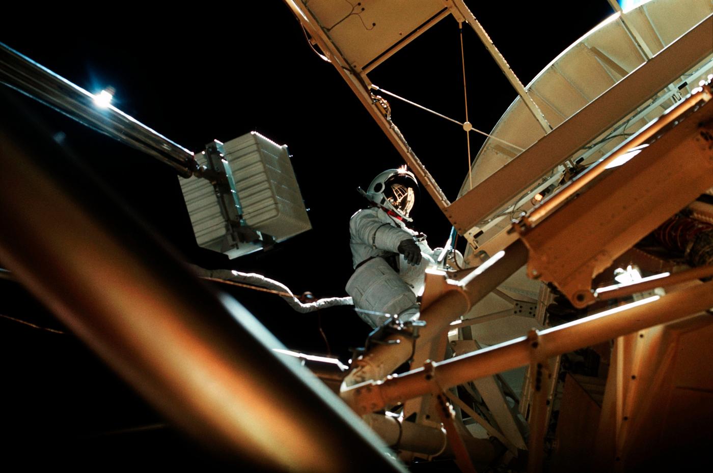 Astronaut participates in EVA to deploy twin polar shield. Original from NASA . Digitally enhanced by rawpixel. Astronaut participates in EVA to deploy twin polar shield. Original from NASA . Digitally enhanced by rawpixel.