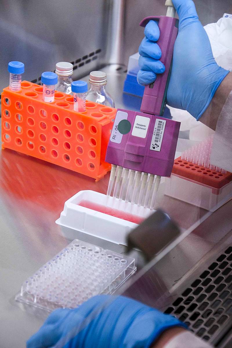 Scientist testing with virus through test tubes. Original image sourced from US Government department: Public Health Image…